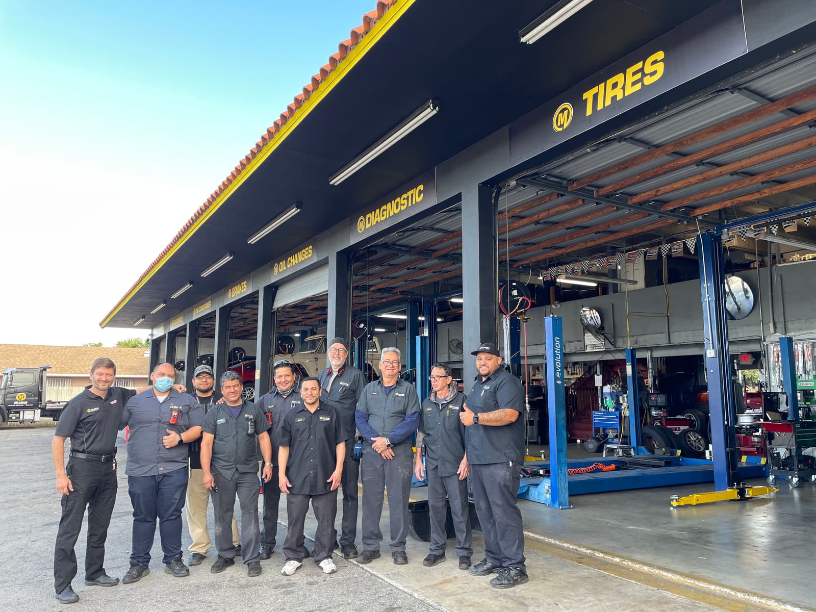 Miller40 team in front of the shop