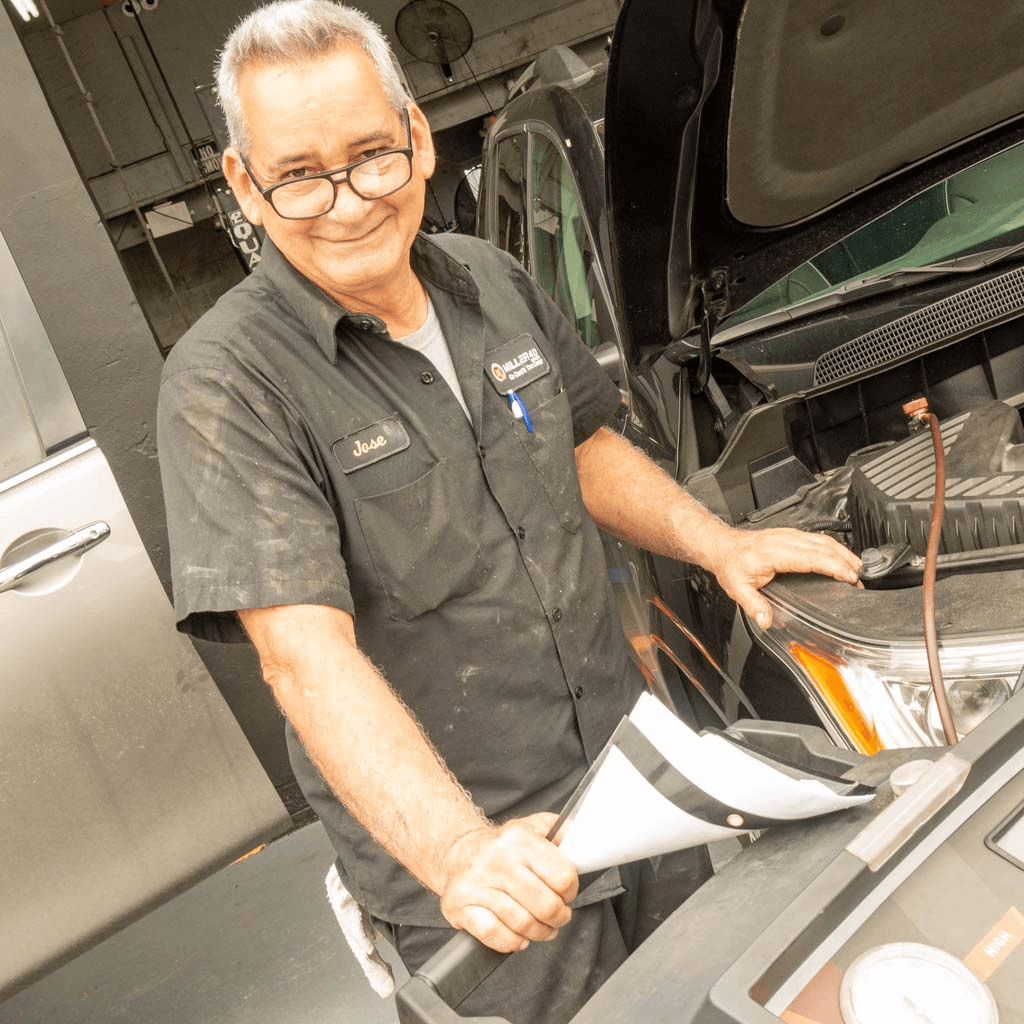 Mechanic working inside a car